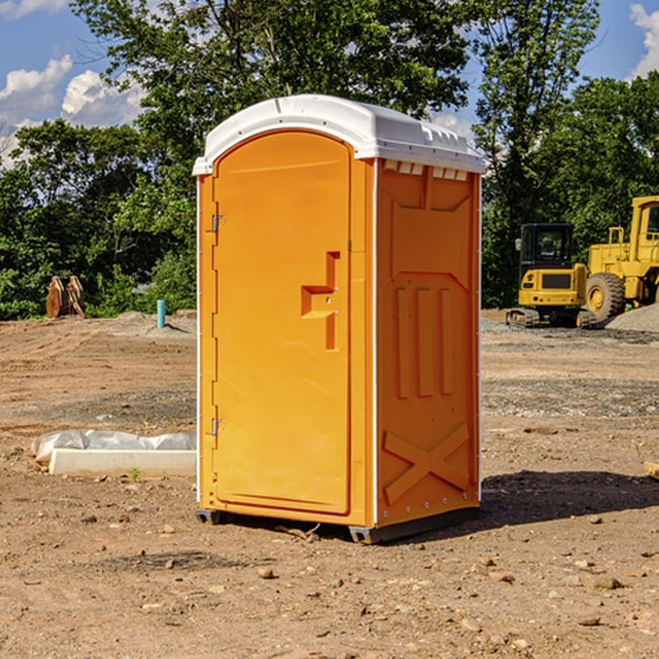 what is the cost difference between standard and deluxe portable restroom rentals in Kossuth County IA